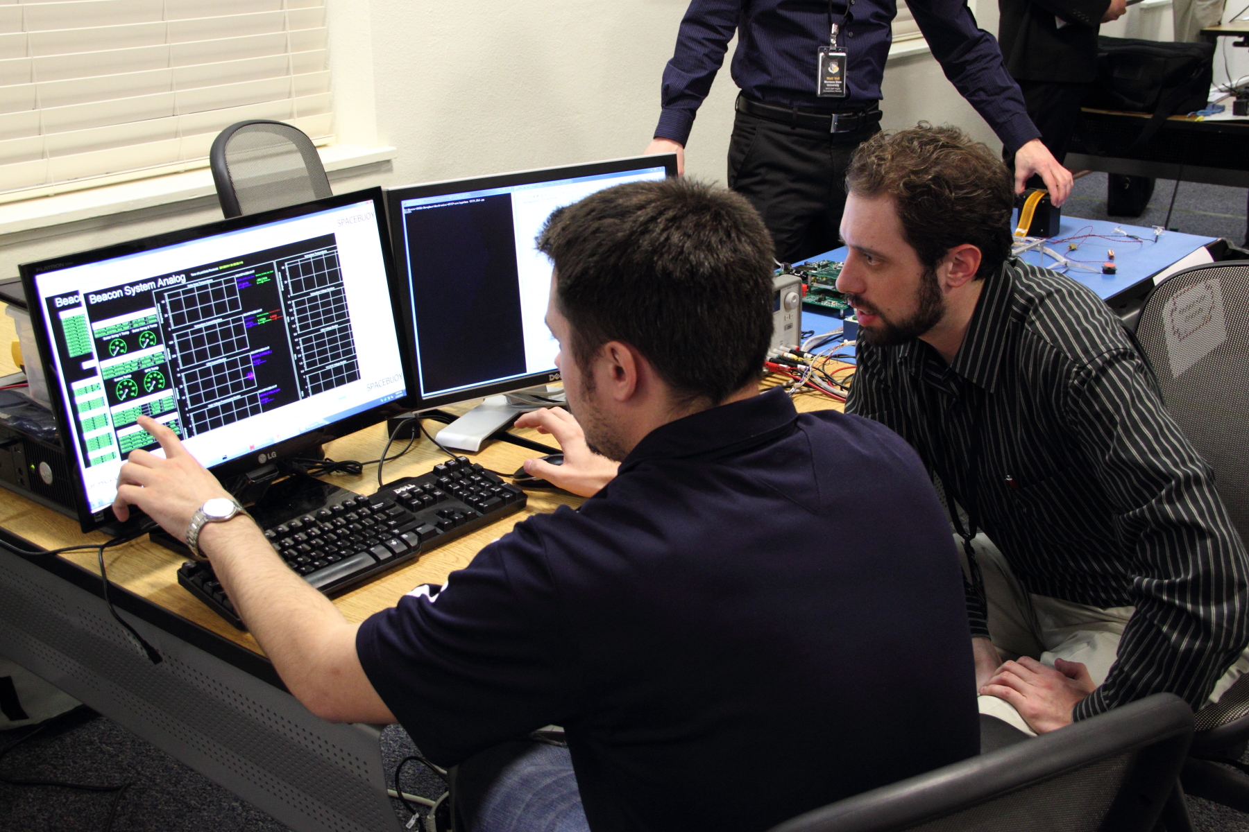 A pair of students arranging windows in the InControl software